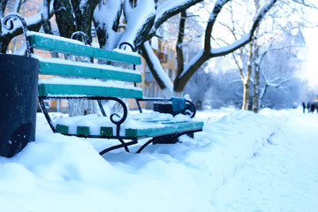bench covered snow winter park