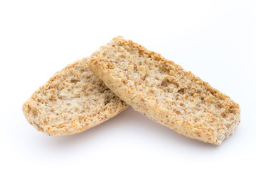 Dry flat bread crisps with herbs on a white background.