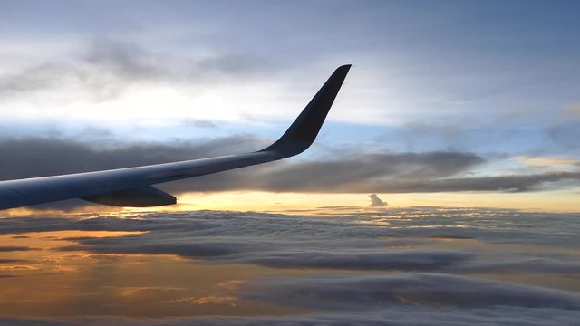 sunset sky form the airplane window 
