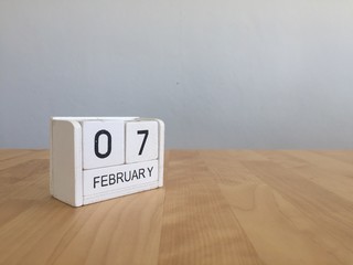 February 7th.February 7 white wooden calendar on vintage wood ab