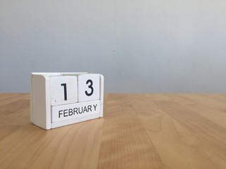 February 13th.February 13 white wooden calendar on vintage wood