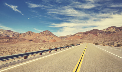 Retro stylized empty road, travel concept.