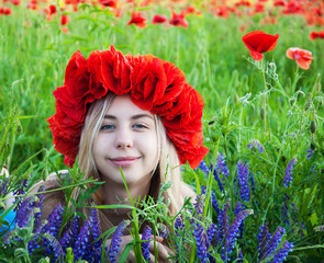 young girl in the poppy field
