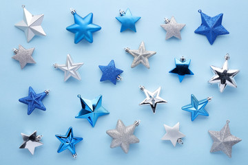 Fototapeta na wymiar Set of glitter stars on blue