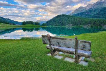 Bench with view of the mountain lake