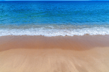 Blue ocean background with sandy beach