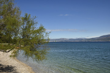 View from shore in Supetar city on Brac island Croatia with the town Split in horizon.