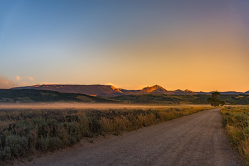 Grand Teton: fog over fields at sunset