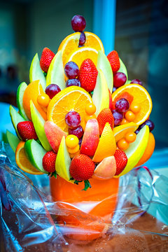 Fruit bouquet from grapes, strawberry, and apples