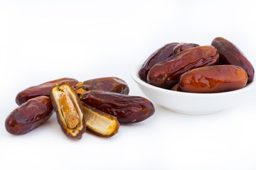 Sweet and healthy dates isolated on white background.