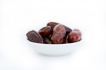 Sweet and healthy dates isolated on white background.