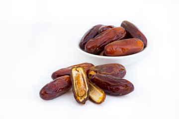 Sweet and healthy dates isolated on white background.