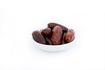 Sweet and healthy dates isolated on white background.