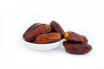 Sweet and healthy dates isolated on white background.