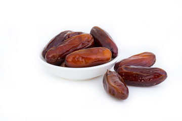 Sweet and healthy dates isolated on white background.