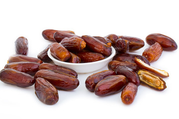 Sweet and healthy dates isolated on white background.
