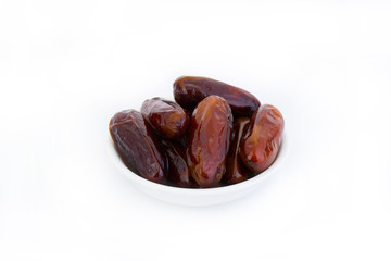 Sweet and healthy dates isolated on white background.