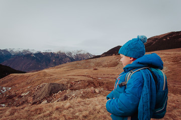 Fototapeta na wymiar little boy enjoy hiking in beautiful mountains