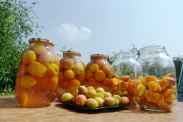 Ripe apricot fruits in glass jars for canning.