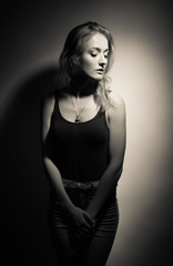 Naklejka premium Beautiful blonde on a black background.