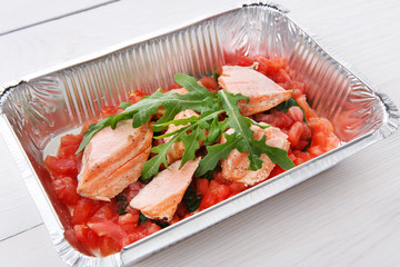 Healthy food in foil boxes, diet concept.