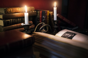 Mysterious Book Lit Up With Candles