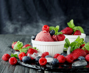 fruit ice cream with fresh strawberries, blueberries and raspberries