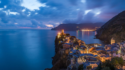Vernazza village, Ocean Rugged Coast Harbour Aerial View Panorama Scenic Postcard view under Dramatic Sky Blur Cloud at Night in Summer. Cinque Terre National Park, Liguria Italy