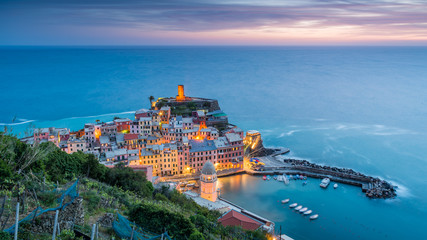 Vernazza village, Ocean Rugged Coast Harbour Aerial View Panorama Scenic Postcard view under Dramatic Sky Blur Cloud at Dusk in Summer. Cinque Terre National Park, Liguria Italy