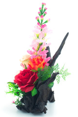 Artificial flowers bouquet in the vase isolated on white