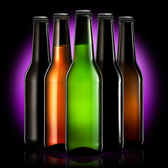 Set of beer bottles with clipping path isolated on black gradient background