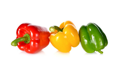 fresh green, red, yellow bell pepper with stem on white backgrou