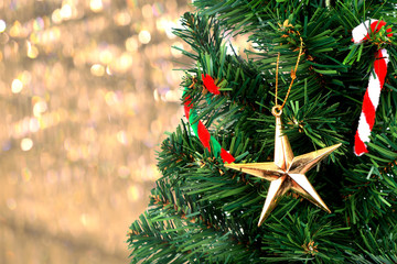 Gold Christmas background of de-focused lights with Christmas-tr