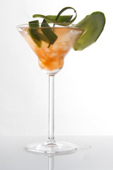 orange cocktail in martini glass