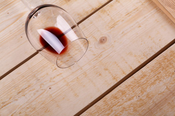 Glass of red wine on wood