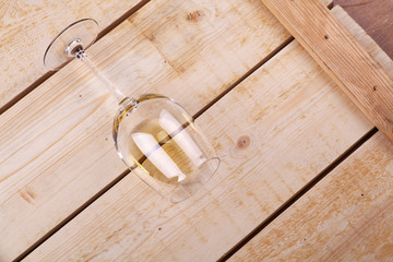 Glass of white wine on wood