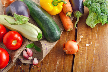 Vegetables on a canvas plain. Fresh healthy ingredients on a table. Top view, above.