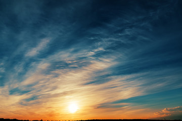 sunset in dark cloudy sky