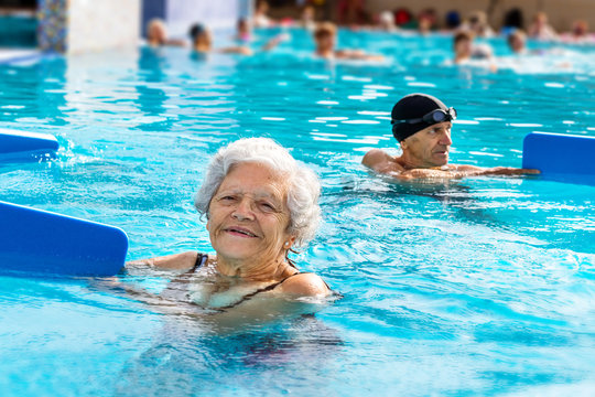 Senior woman at aqua gym session.