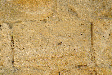 Stone wall, detail of an ancient wall of Monteriggioni, medieval town in Tuscany, Italy