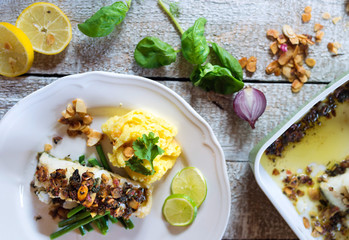 Zander fish fillet dish on a plate on a wooden table