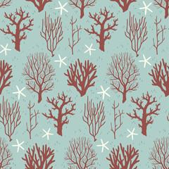 Fototapeta premium Seamless pattern with corals and starfishes on a blue background