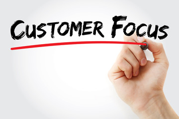 Hand writing Customer Focus with marker, concept background