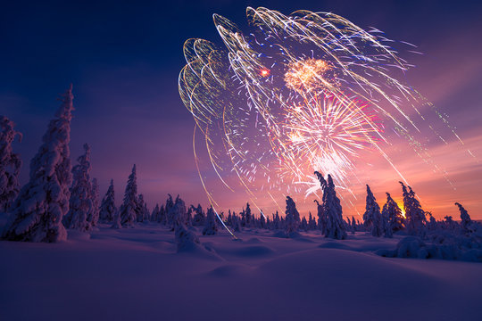 Winter landscape with fireworks.