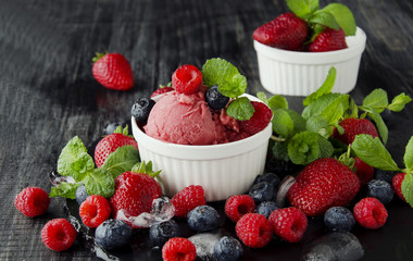 fruit ice cream with fresh strawberries, blueberries and raspberries