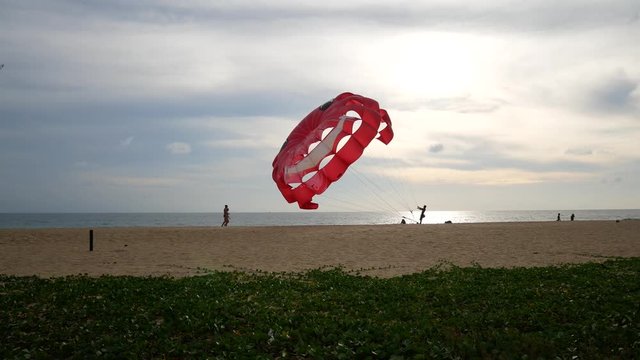 4K parasail on the beach with sunset background , Phuket , Thailand