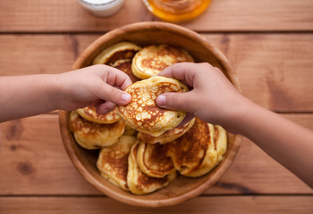 Homemade Pancakes with honey and glass of milk in wooden dish. Pumpkin Pancakes.