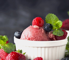 fruit ice cream with fresh strawberries, blueberries and raspberries