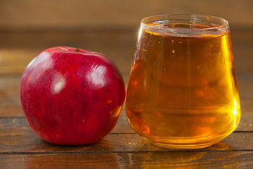 Delicious fresh squeezed apple juice in  transparent glass