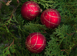 Fototapeta na wymiar Christmas decoration. Red balls on wooden table